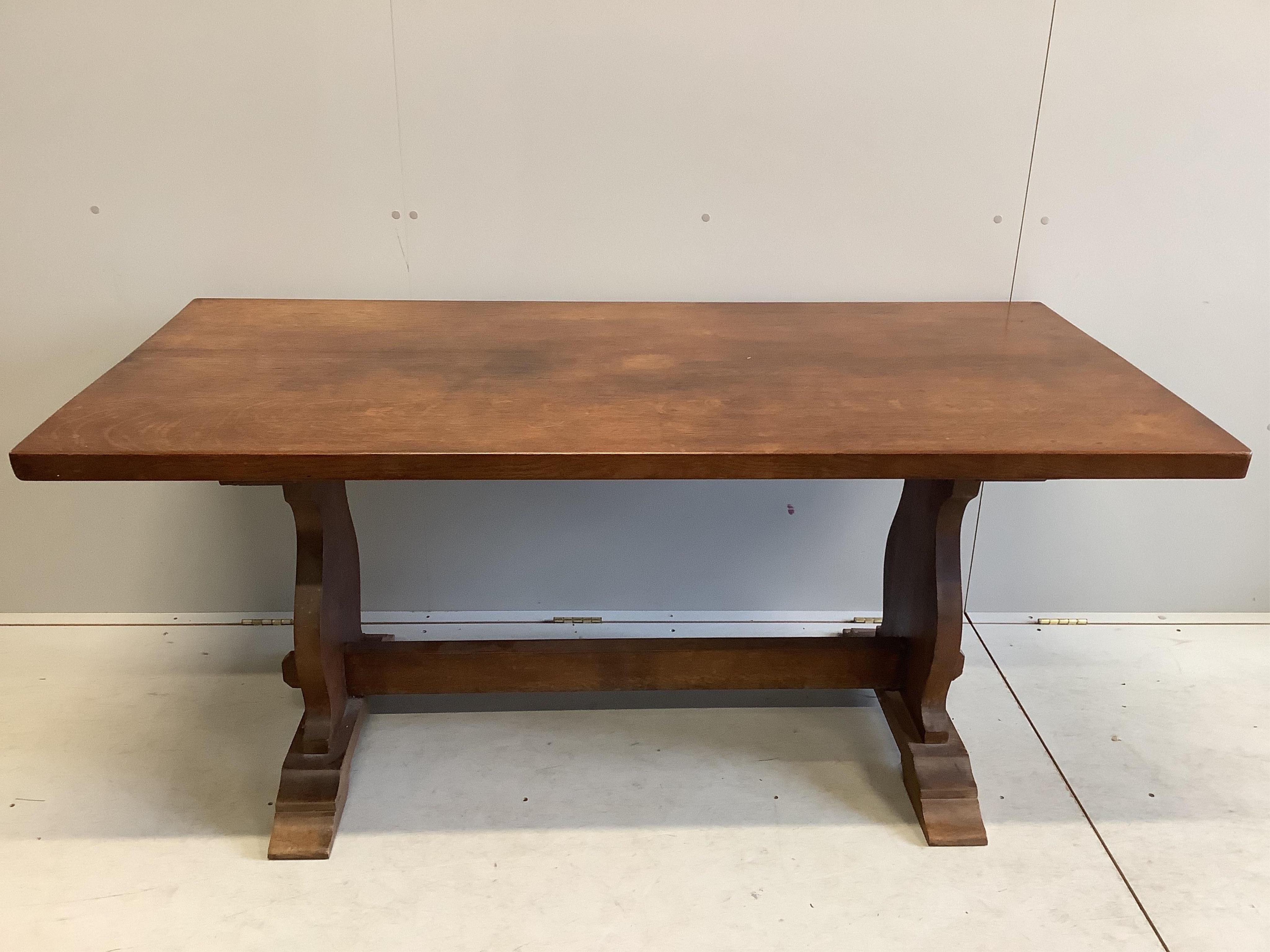 A 17th century style rectangular topped oak refectory table, width 168cm, depth 79cm, height 74cm. Condition - fair